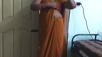 A Tamil wife in a saree exposes her shaved pubis and large breasts